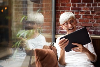 Adult learning a new language using a tablet