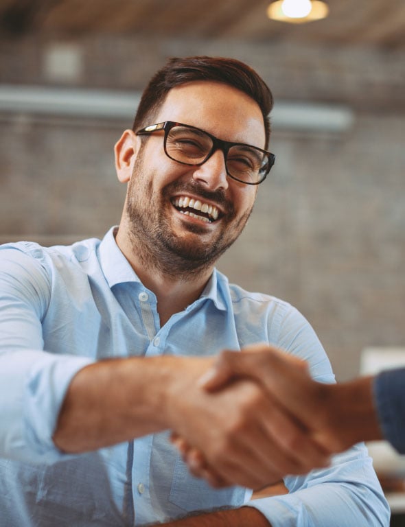 man-smiling-shaking-hands