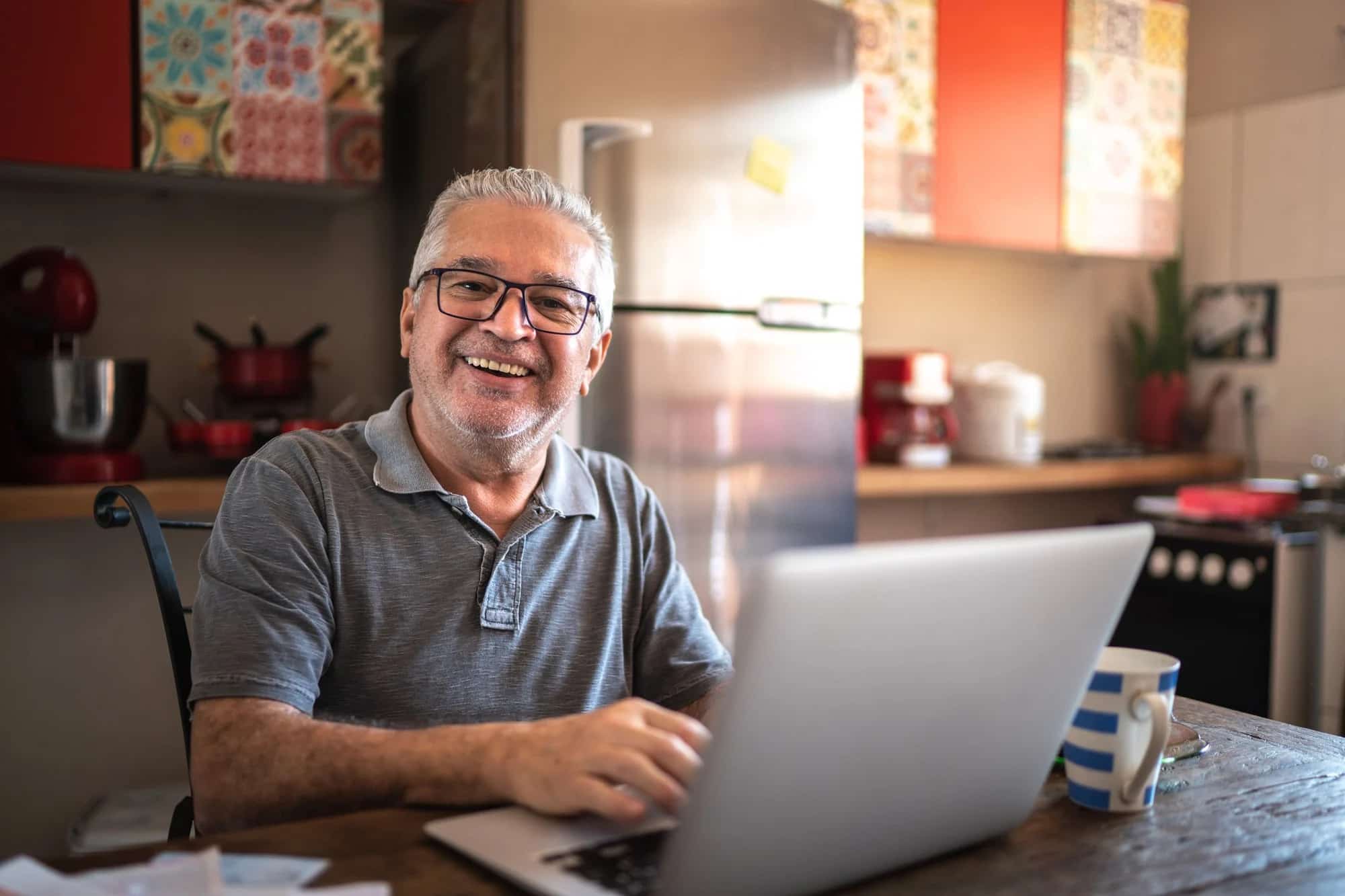 smiling man at computer