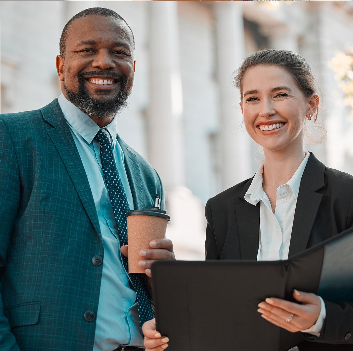 smiling professionals outside