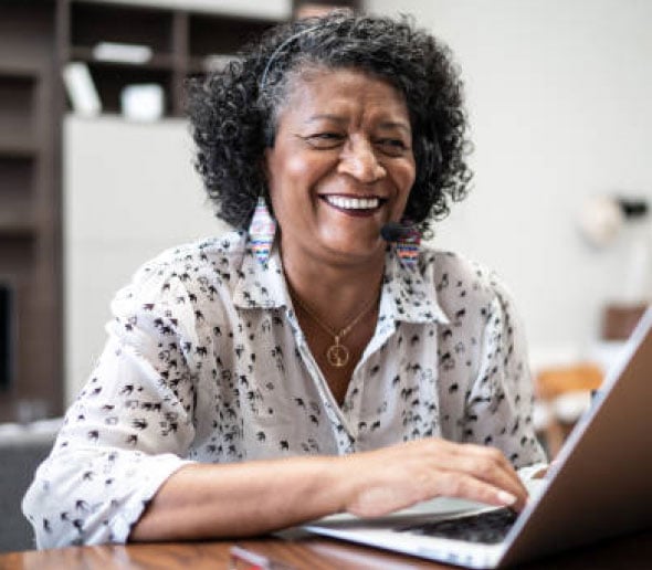 smiling woman at laptop