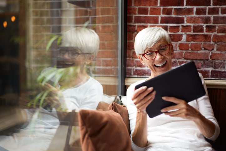 Adult learning a new language using a tablet